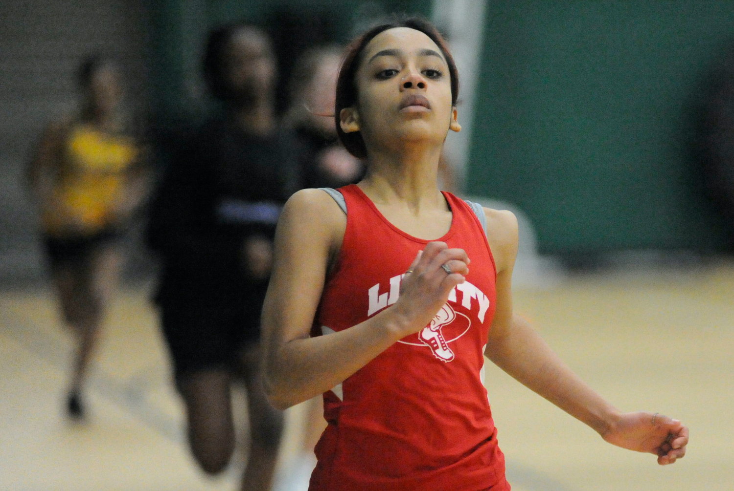Liberty’s Tatiana Reyes, a senior, competes in the 55-meter and 300-meter events.